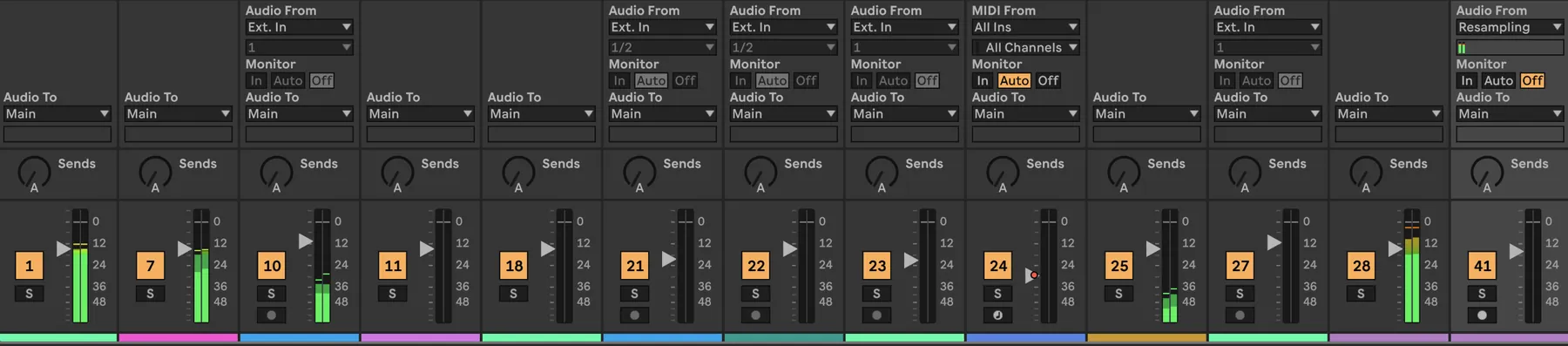The Ableton mixer with twelve channel strips showing input and output routing, sends, faders and level meters